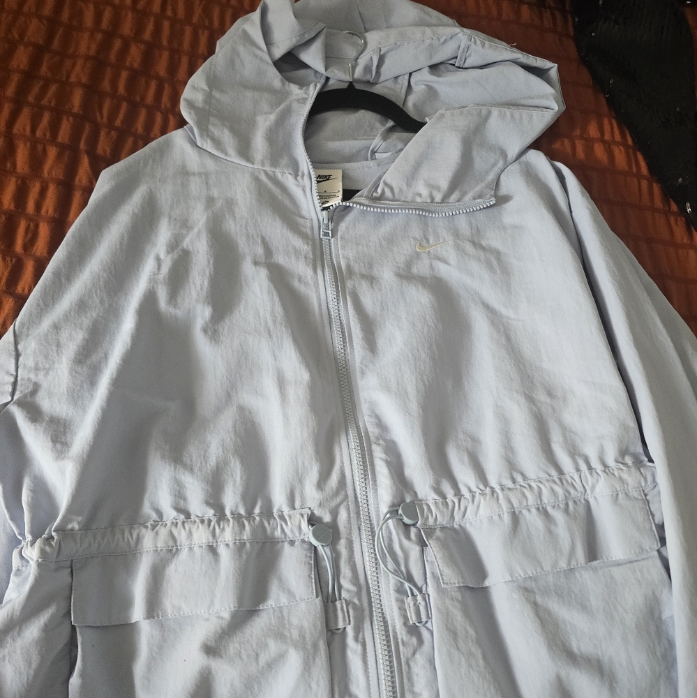 Nike Women's Light Blue Windbreaker Jacket with cinched waist